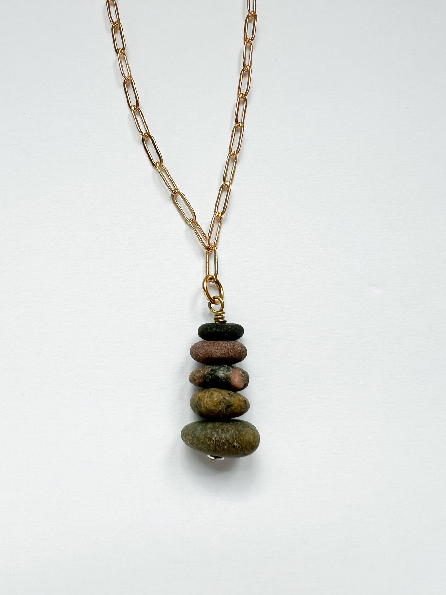 Necklace with stone pendant on a white background