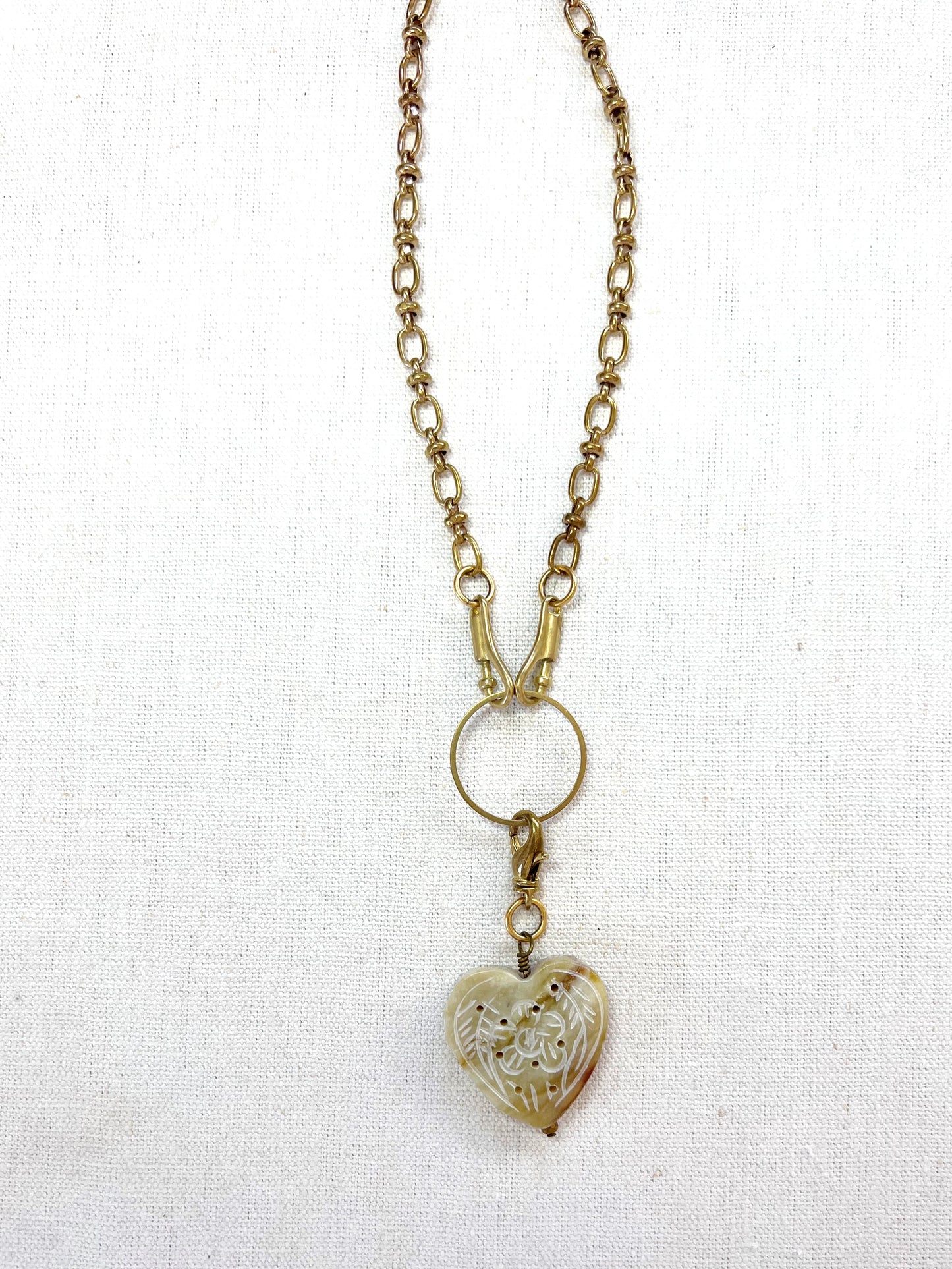 Necklace with a heart-shaped pendant on a white background