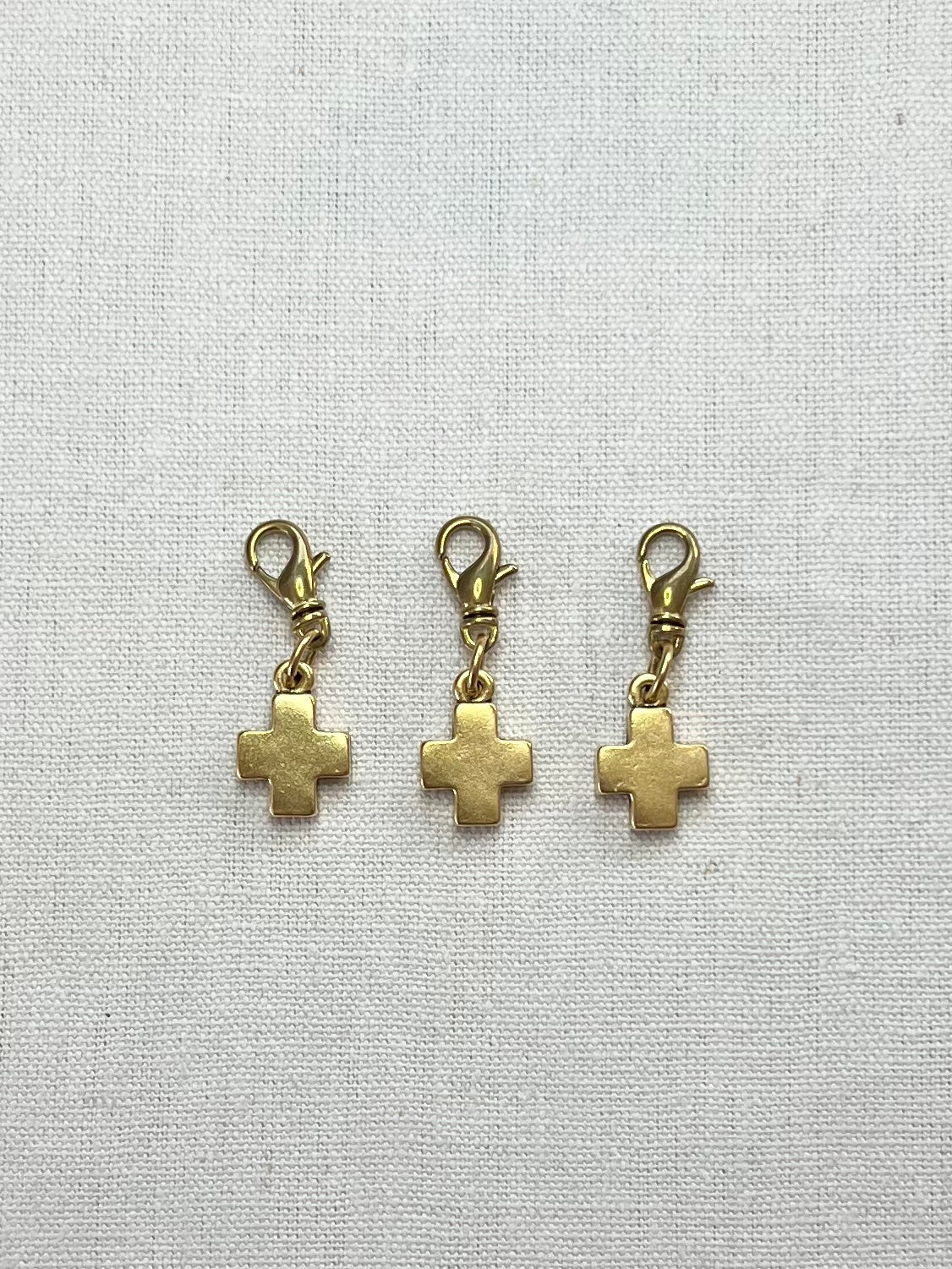 Three gold block cross charms for a charm necklace