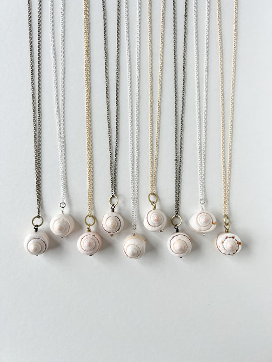 Shell necklaces on a white background.