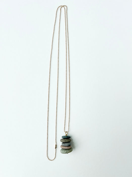 Lake stones on a gold ball chain necklace.