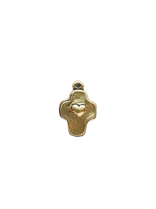 Gold pendant with a heart design on a white background