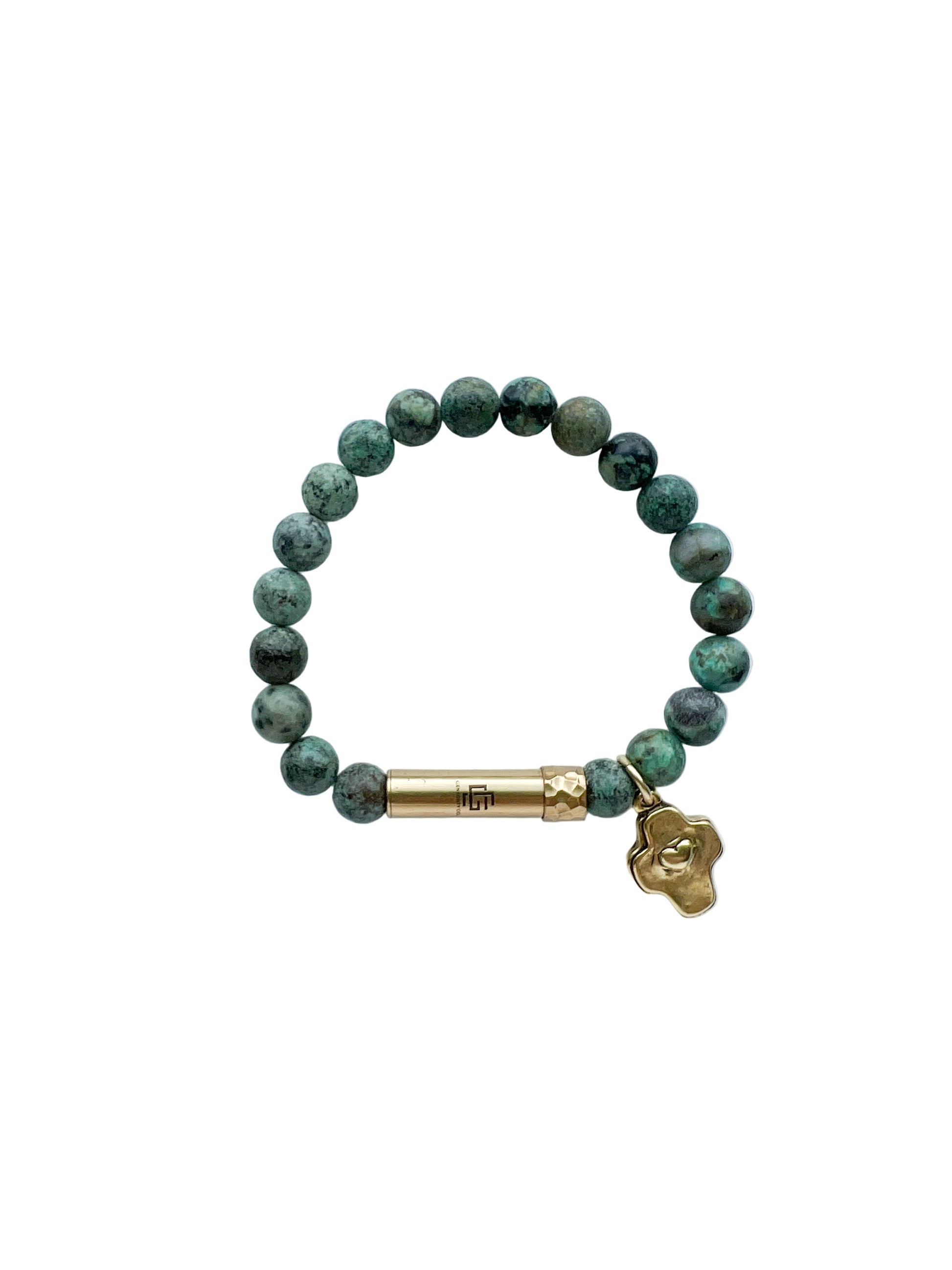 Green beaded bracelet with gold cross charm and brass tube clasp on a white background