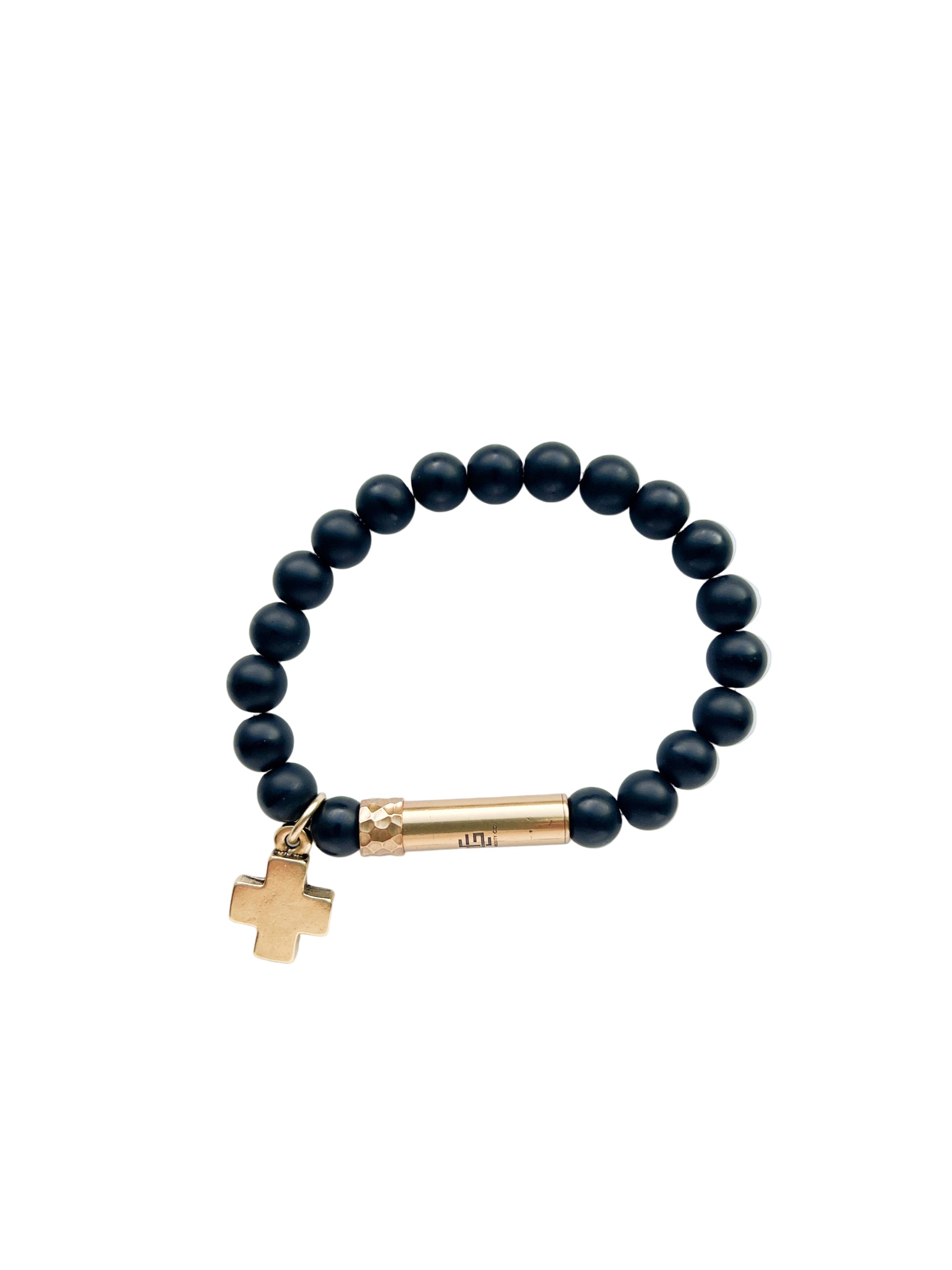 Black beaded bracelet with a brass tube clasp and cross charm on a white background
