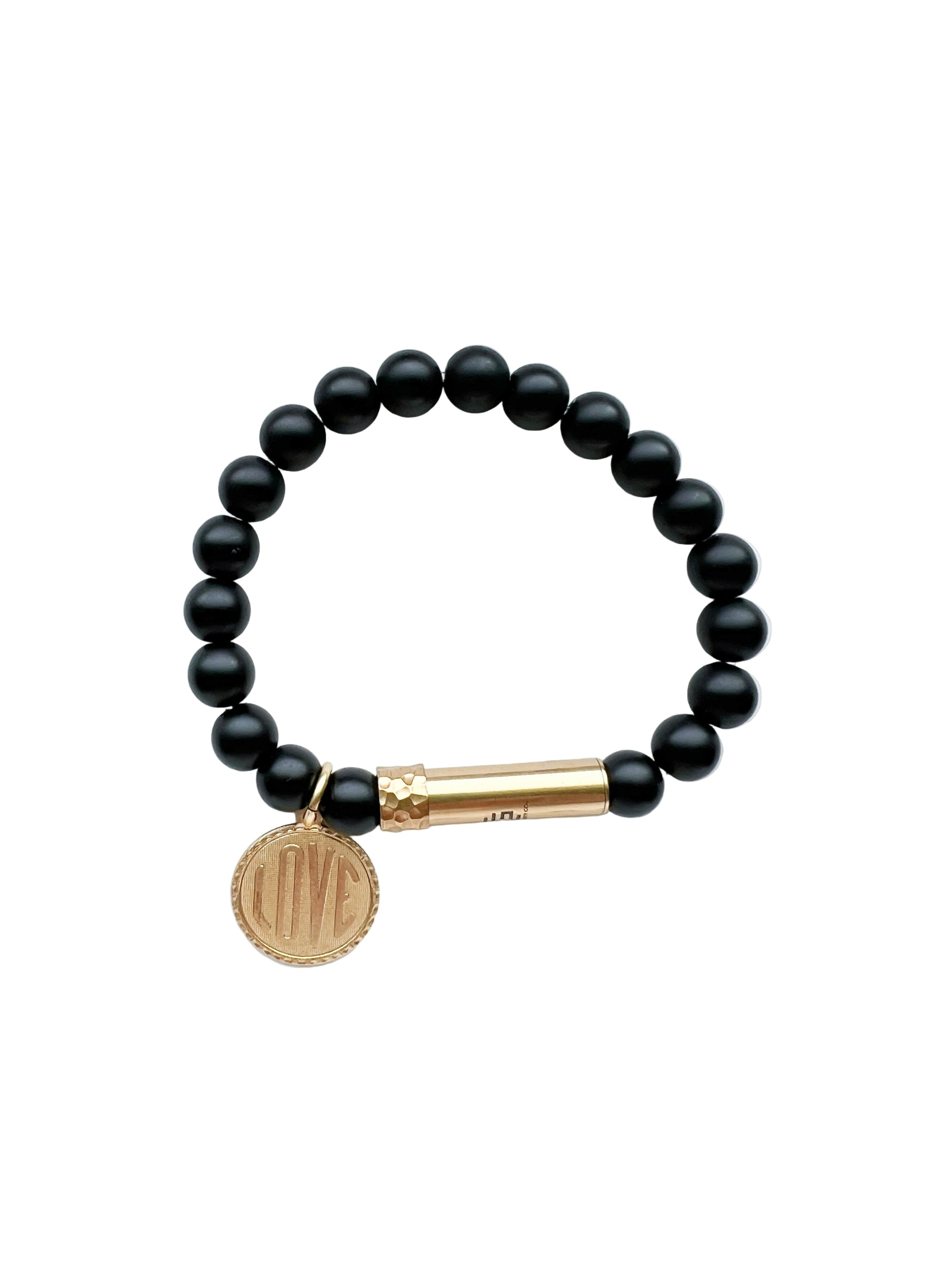 Black beaded bracelet with a gold clasp and a vintage charm that says love on a white background