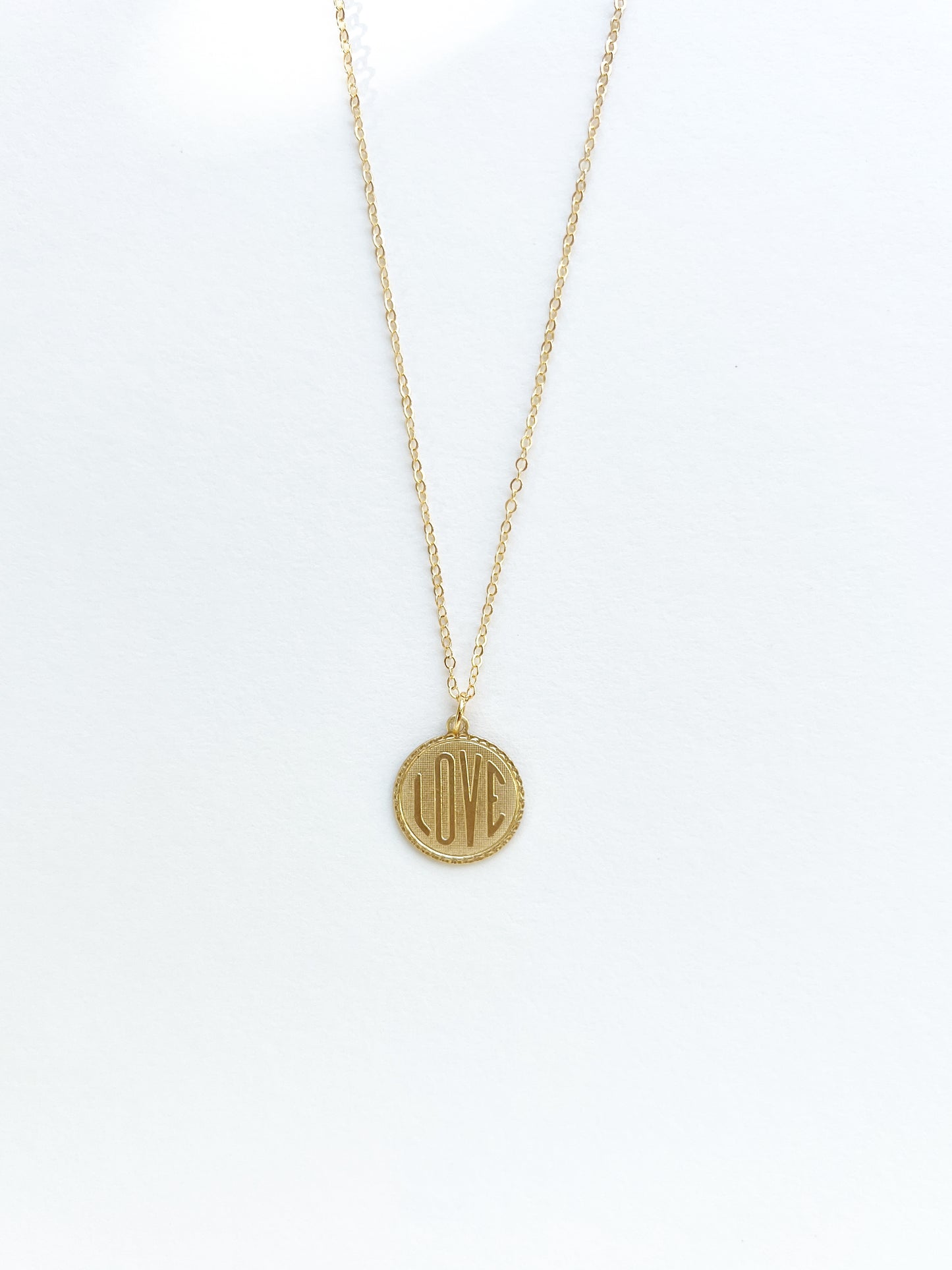 Gold filled necklace with vintage brass love charm