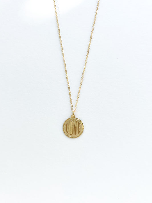 Gold filled necklace with vintage brass love charm